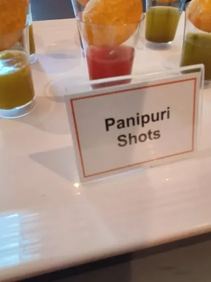 A close-up of our innovative Panipuri Shots, a modern and stylish way to serve a classic street food favorite. They are perfect as a passed appetizer at any event.