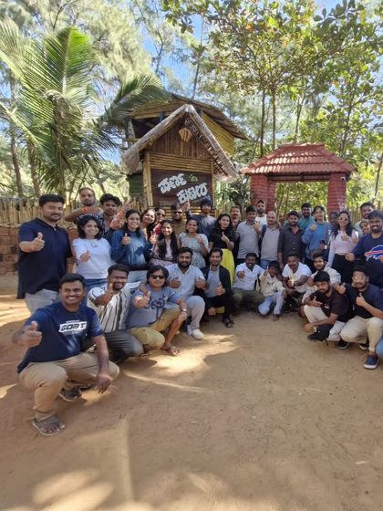 A happy group photo at a beachside shack. We make sure to enjoy the local culture and hospitality.
