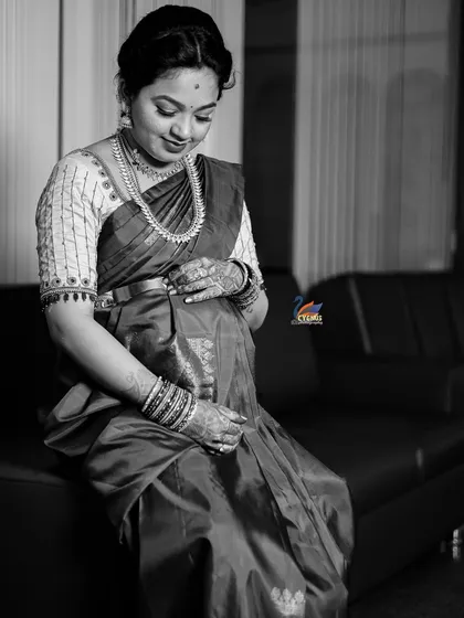 A timeless black and white portrait. This style adds a classic, emotional feel, focusing on the mother-to-be's expression and the curve of her baby bump.