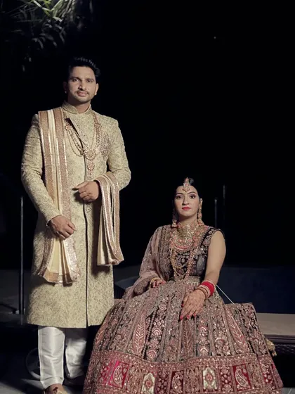 This is the look that turns heads. A perfectly coordinated couple in our premium rental wedding attire, featuring a heavily embroidered bridal lehenga and a regal groom's sherwani. We make sure you both look like royalty on your big day.