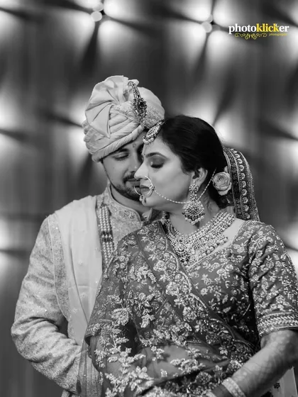 An intimate black and white portrait that focuses purely on the couple's connection. This artistic style strips away color to emphasize emotion, creating a timeless and powerful image of their bond.