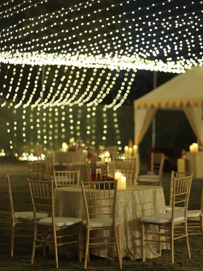 The magical ambiance of the Sufi night, with tables set under a canopy of fairy lights. The combination of intimate candlelight and a sky of lights is pure romance.