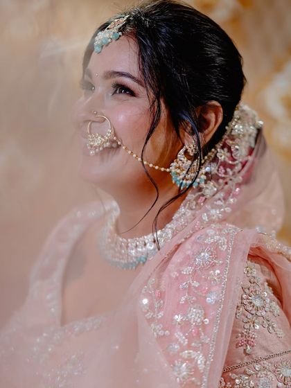 A bride's happy, upward glance, captured with a soft, hazy effect. This portrait feels dreamy and full of joy.