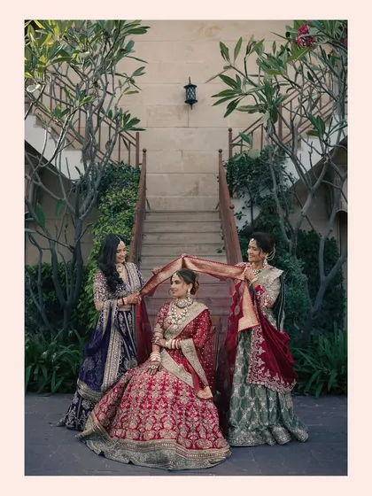 A beautiful moment between the bride Krisha and her sisters or bridesmaids, as they help her with her veil. We capture the bonds of friendship and family.