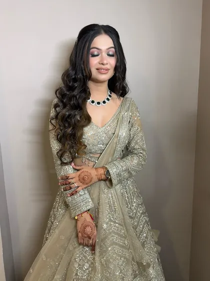 A beautiful pose showing off the blended eye makeup and the full, bouncy curls.