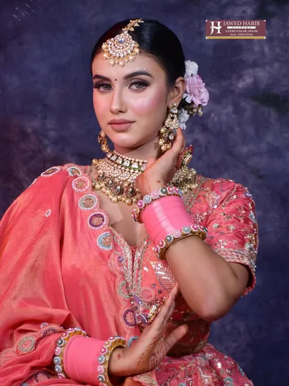 Learn the art of creating the perfect traditional bridal look. This image showcases the intricate details, from flawless makeup to classic hairstyling, that we teach in our professional makeup artistry courses.