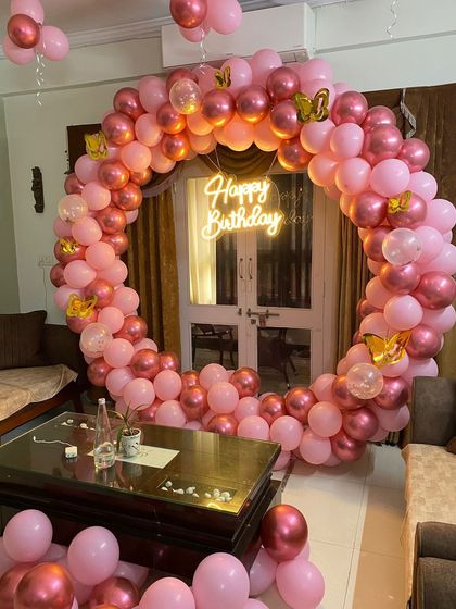 This setup was created in a living room, showing how I can adapt large backdrops to fit into home environments. Small butterfly details were added to the balloons.