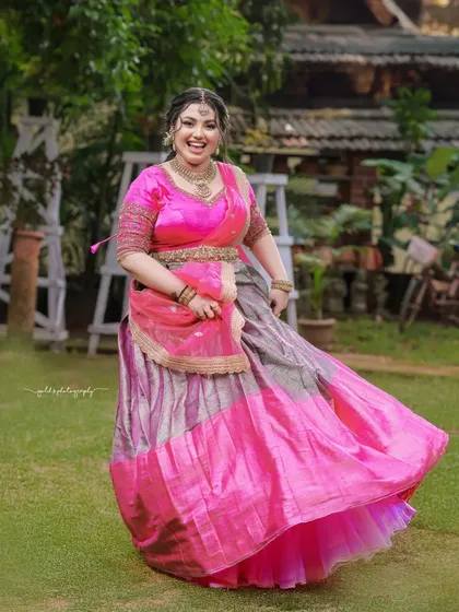 The twirl of the lehenga skirt creates a beautiful sense of movement and celebration. This is a classic shot for any bride.