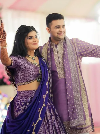 The happy couple twinning in purple for their Haldi. Their coordinated outfits and happy smiles make for a perfect picture.