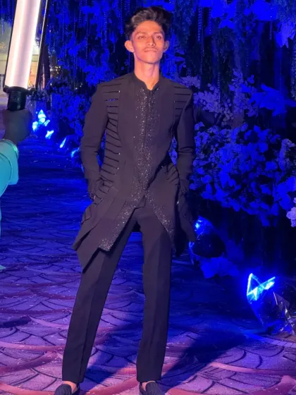Pushing the boundaries with this black Indo-western design. It features a structured, asymmetrical cut with precise katdana detailing for a sharp, architectural look.