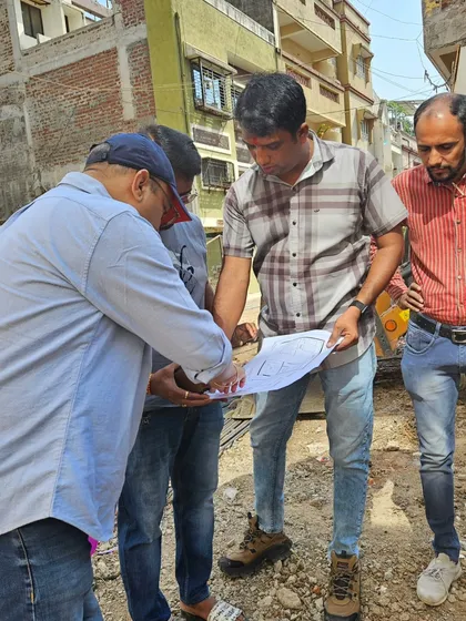 Explaining the Vastu chart to the construction manager. Clear communication ensures that my recommendations are implemented correctly.