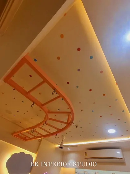 A view of the false ceiling in the kids' room. I used a polka-dot pattern and a curved monkey bar to make the ceiling a fun part of the room's design.