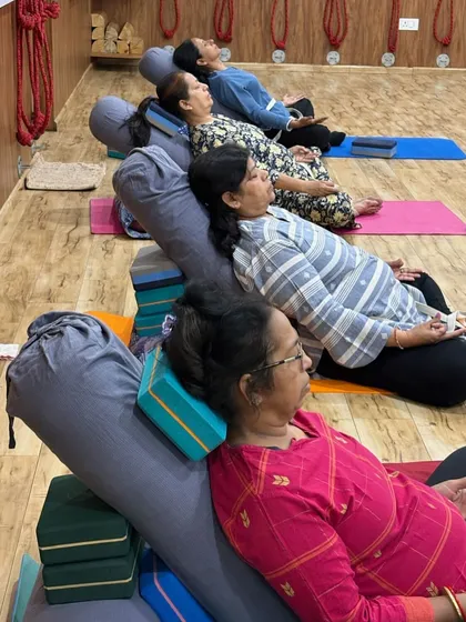 Our therapy yoga is for every body and every age. We use props like bolsters and blocks to create a comfortable, supported environment for deep relaxation and gentle stretching, perfect for managing chronic pain or simply unwinding.