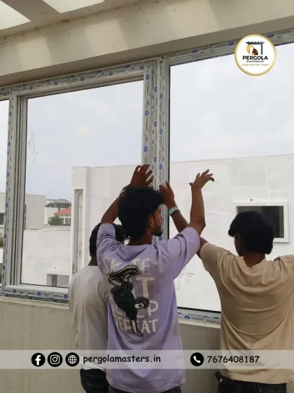 Teamwork is key to a successful installation, especially with large window units. Here, our crew is carefully maneuvering a large UPVC window into place, ensuring it is perfectly level and aligned before being permanently secured.