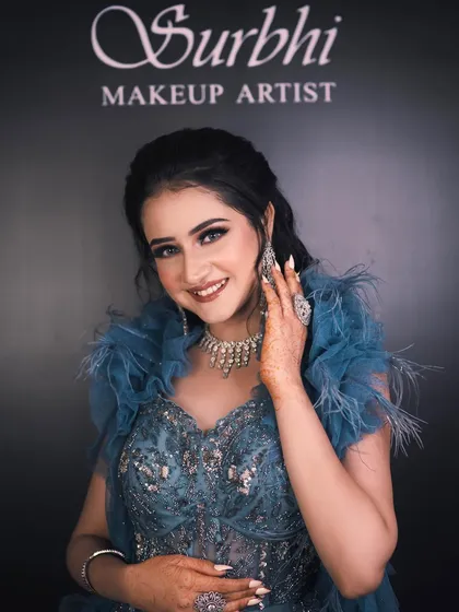 This bride's pose exudes confidence. Her makeup, with its dramatic eyes and flawless finish, is designed to make her feel like a star.