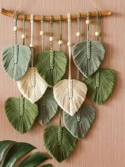 A beautiful wall hanging made entirely of macrame leaves in serene shades of green and cream. This piece brings a sense of calm and nature indoors.