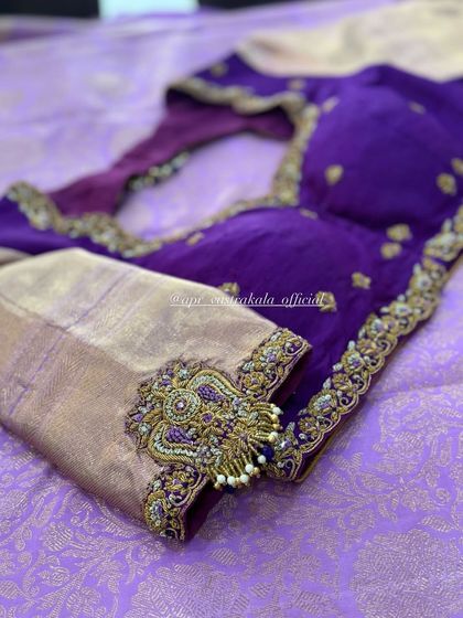 Another view of the purple blouse with the statement sleeve motif.