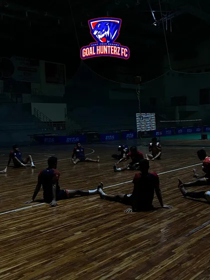 The Goal Hunterz FC team stretches under their illuminated logo. The dramatic lighting showcases our ability to create a unique and branded atmosphere for any team.