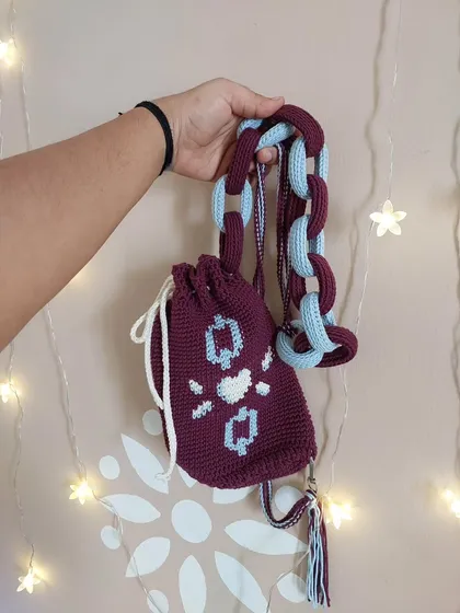 For a modern and edgy look, I designed this Elara sling bag. It features a unique tapestry crochet pattern and a chunky, two-toned chain strap that makes it a standout accessory for everyday use.