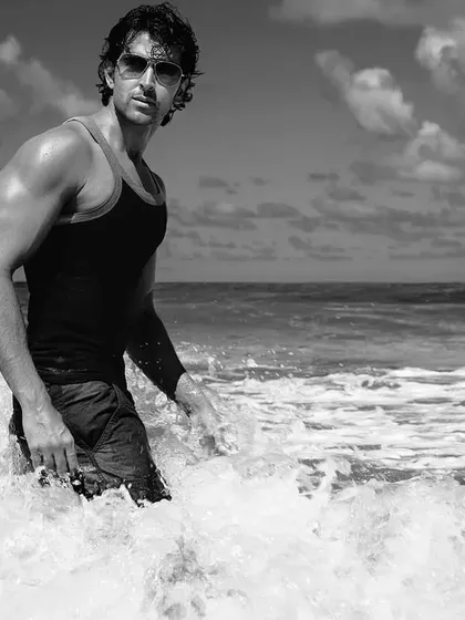 Black and white photography has a way of capturing the soul of a moment. For this shoot with Hrithik Roshan, we were at the beach, and I wanted to create something that felt both powerful and elemental. The crashing waves and his strong presence combine for a truly cinematic shot.
