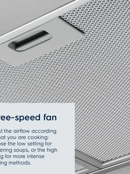 A close-up of the high-efficiency filter and three-speed fan control on an Electrolux hood. You can adjust the airflow from a low setting for simmering to a high setting for more intense frying.
