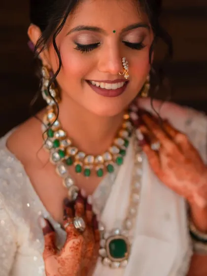 A serene close-up of the bride. This shot highlights the soft, blended eyeshadow and the perfectly matched foundation that creates a flawless, skin-like finish.