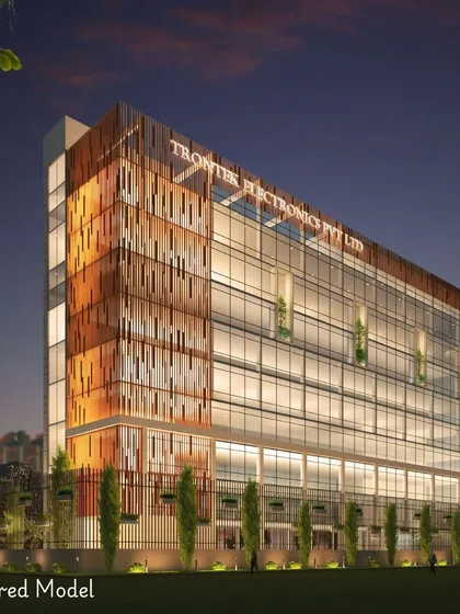 A rendered model of the Trontek headquarters at dusk. This visualization highlights how the building's lighting and material textures, including the perforated clay tile facade, create a dynamic and modern aesthetic.