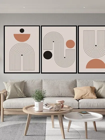 This set of three geometric prints features contour lines and abstract shapes. The balanced compositions and earthy color palette make for a sophisticated and modern triptych.