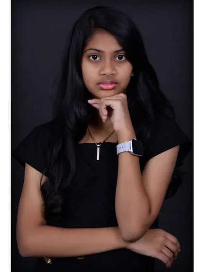 A classic studio portrait of a teen against a solid dark background. This is a great option for a clean, professional look that can be used for various purposes.