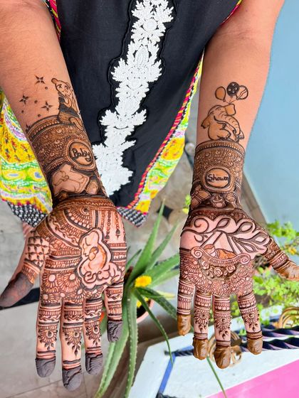 A fun and creative baby shower mehendi. This design includes a teddy bear with balloons, a baby in a cradle, and the words 'Baby Shaw' to celebrate the mom-to-be.