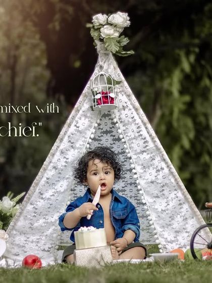 Sunshine mixed with a little mischief. A fun cake smash moment during an outdoor first birthday session in our teepee.