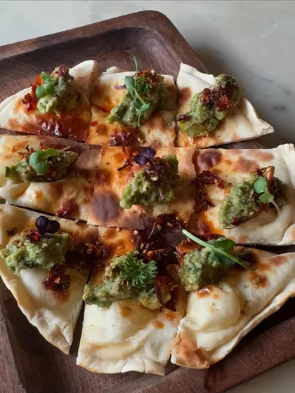 A popular sharing plate from our brunch menu. This is our avocado and chili flatbread, a simple yet delicious starter to share with the table.