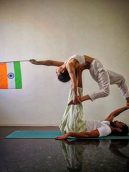 Another view of our Independence Day acro yoga practice. It is a symbol of lifting each other up and finding harmony together.
