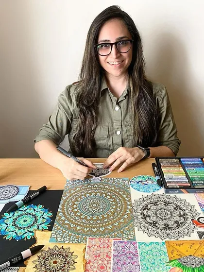 Here I am with a collection of my favorite pieces! I love working with all kinds of materials, from markers and pastels to digital tools, and I'm so excited to share my passion with you.