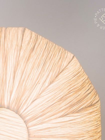 A close-up of our woven lampshades, which create a soft, diffused light throughout the cafe.