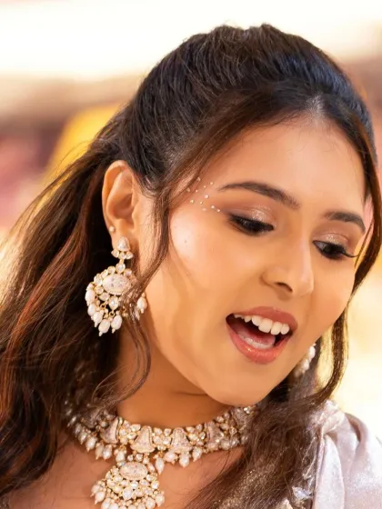 Another close-up of the Sangeet glam, showcasing the shimmery eyeshadow and flawless skin. This look is perfect for a night of dancing and celebration.