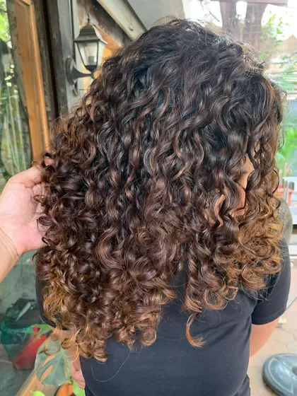 Curls, swirls, and a touch of magic. A gorgeous non-bleach transformation that gives these ringlets beautiful dimension and shine.