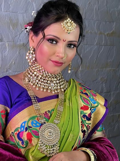 A bold and beautiful choice. This bride rented a statement polki choker and a dramatic, oversized rani haar to pair with her vibrant Paithani saree.