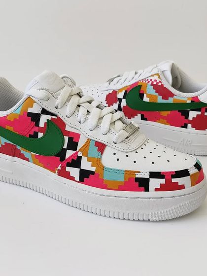 A full view of the Dhurrie weave inspired AF1s. The combination of pink, red, turquoise, and black creates a vibrant and modern look while honouring a traditional craft.