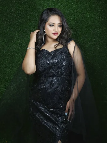 A closer look at the geometric sequin pattern on the black gown. It's a sophisticated detail that makes the dress stand out.