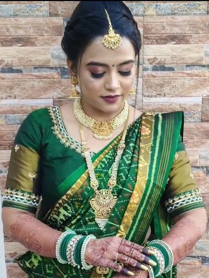 My beautiful bride Kinjal in a traditional green South Indian-style saree.
