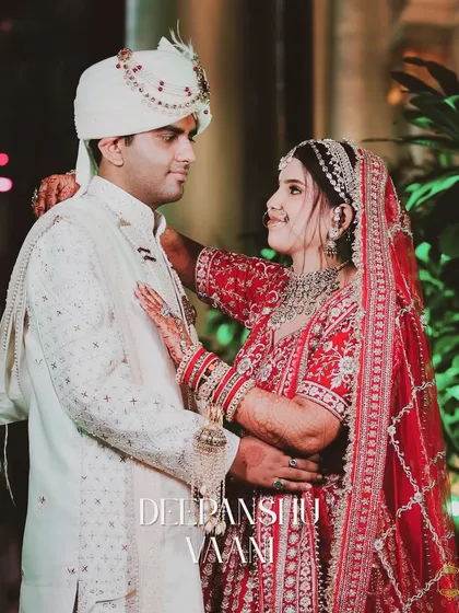 A classic portrait of the bride and groom looking at each other, with their names elegantly written on the image.