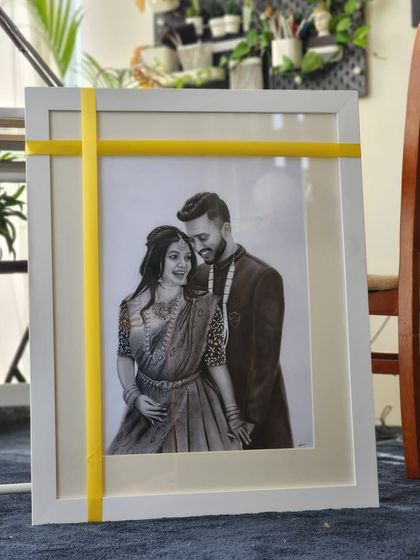The finished couple portrait, framed and ready to be gifted. I offer simple, elegant framing options to complement the artwork and make it ready to display.