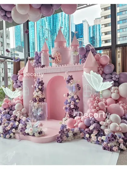 The full pink princess castle backdrop, set against a city skyline, showcasing how I can transform any space into a fairytale setting.