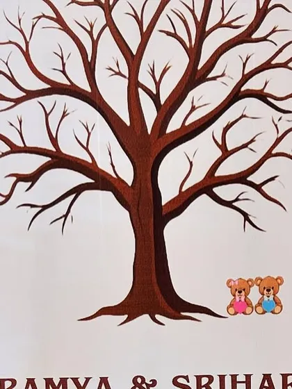 A creative guest book alternative for a baby shower. Guests can leave their thumbprint "leaves" on the tree to create a beautiful keepsake for the family.
