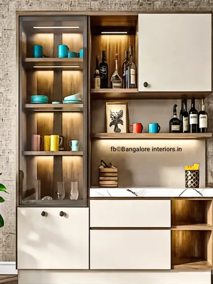 A contemporary crockery and bar unit with a mix of open and closed storage. The glass-fronted cabinet with internal lighting beautifully displays glassware, while the shelves and drawers offer practical storage.