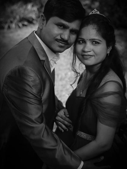 A classic black-and-white couple's portrait. The direct eye contact with the camera creates a powerful and engaging image, showcasing their bond.