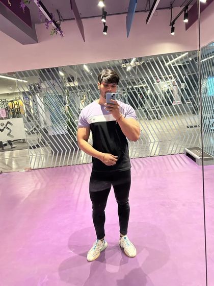 A full-body selfie showing leg and upper body development.