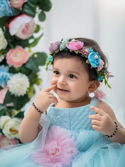 A sweet, shy smile from our little fairy. We focus on capturing a range of expressions, from playful giggles to these quiet, thoughtful moments.