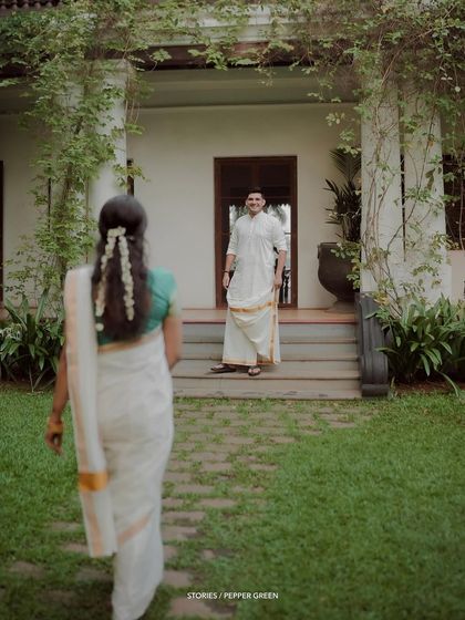 A "first look" moment, as the bride walks towards her waiting groom.